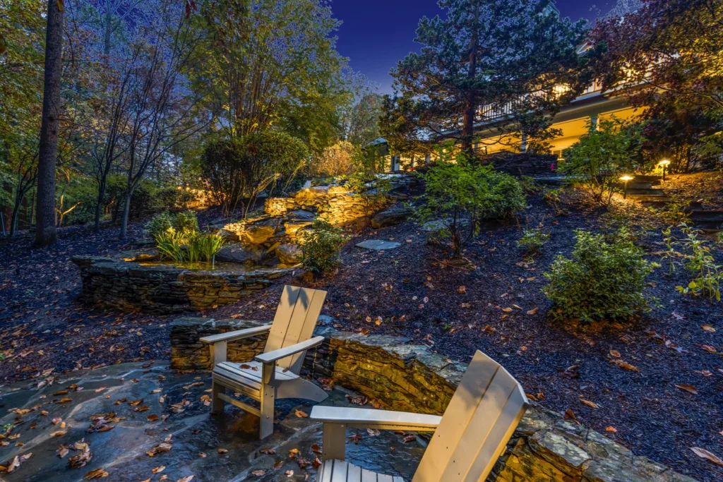Outdoor landscape lighting illuminating chairs