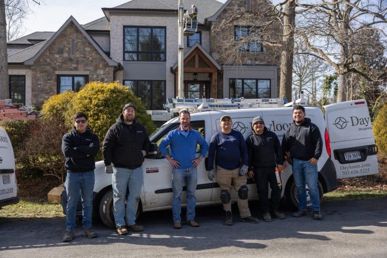The Dayloom installation crew standing beside a Dayloom van at a McLean project.