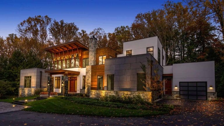 Landscape lighting on a modern McLean, VA home at dusk