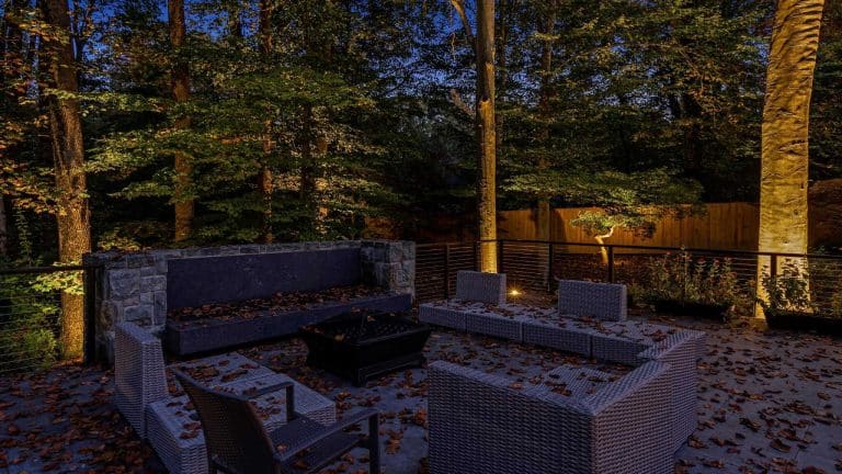 Outdoor seating area and fireplace lighting at a McLean, VA home