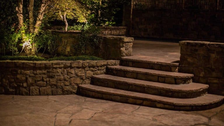 Step and wall lighting on stone terrace steps at a McLean, VA home